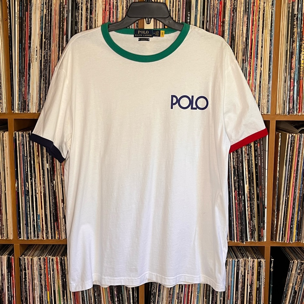 White with multi color Polo t shirt.